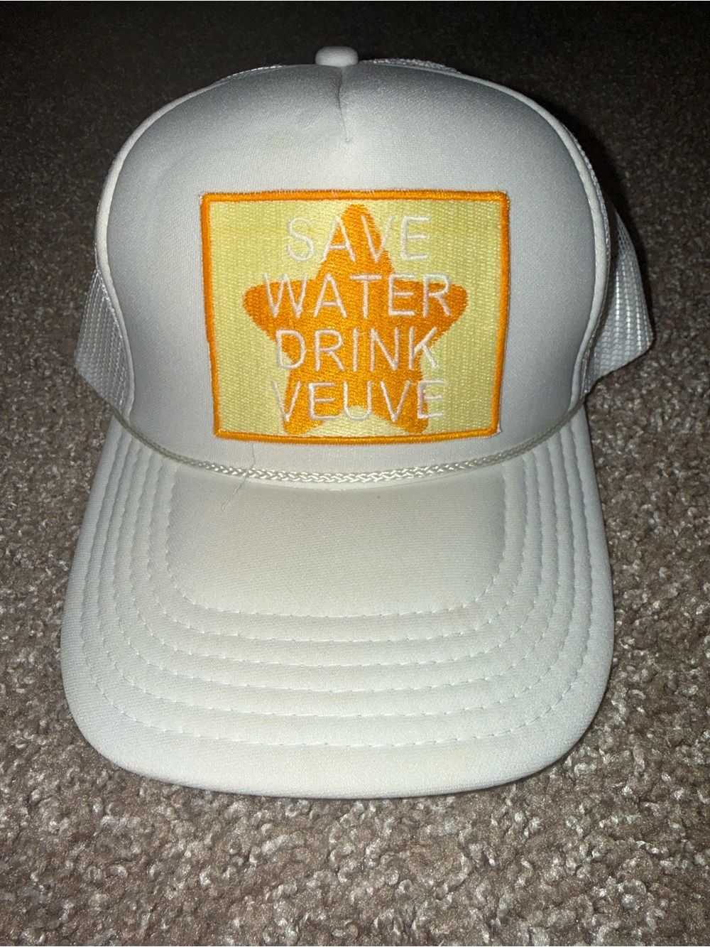 White Trucker Hat with Orange 'Save Water Drink Veuve' Patch